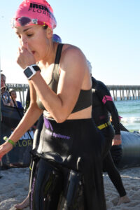 Swimmer in wetsuit on the beach